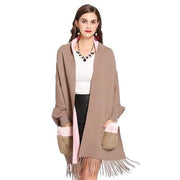 Dames Poncho met Bontzakken